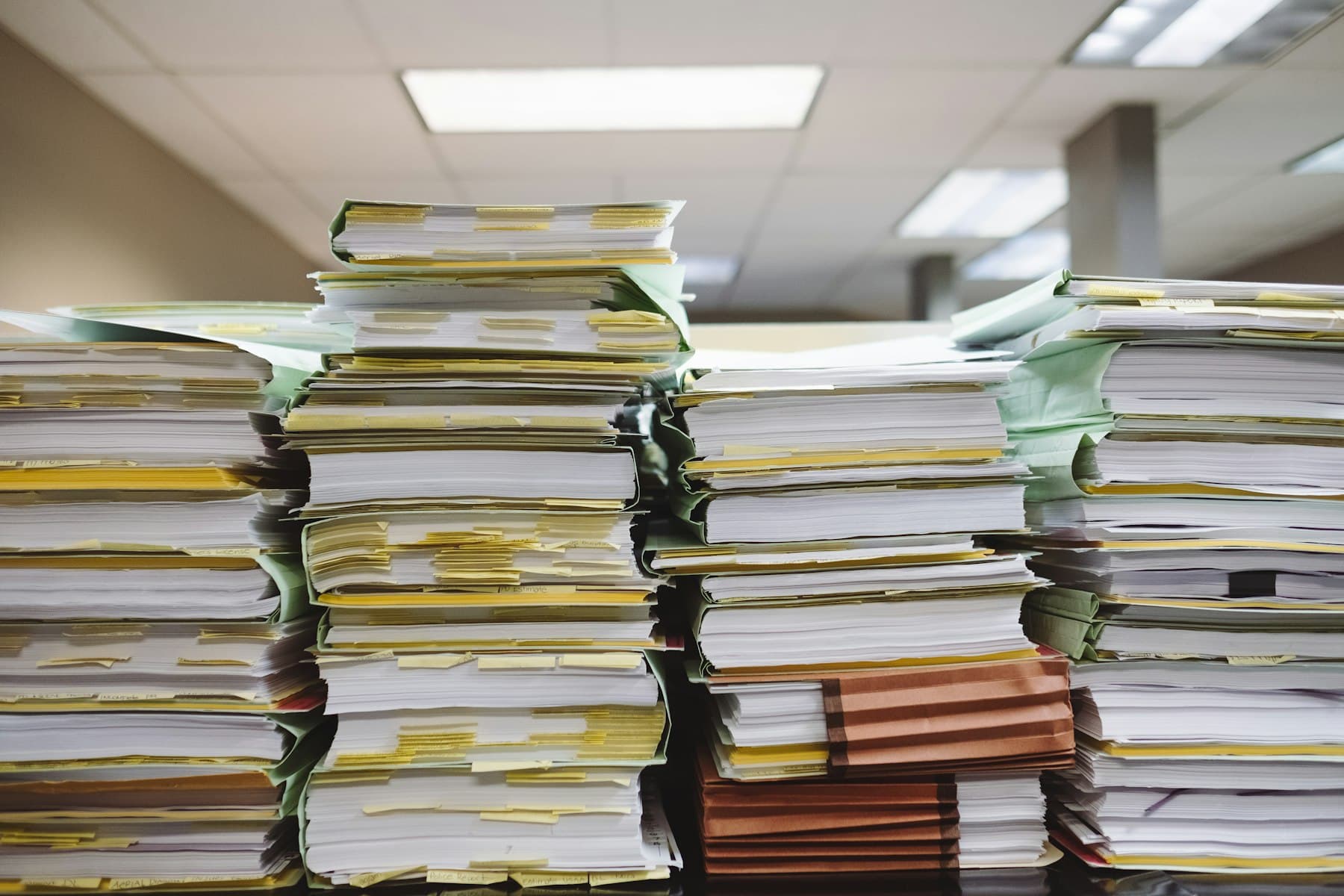 Stacks of legal documents and file folders